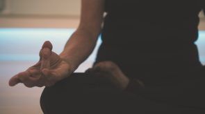 person doing yoga on floor